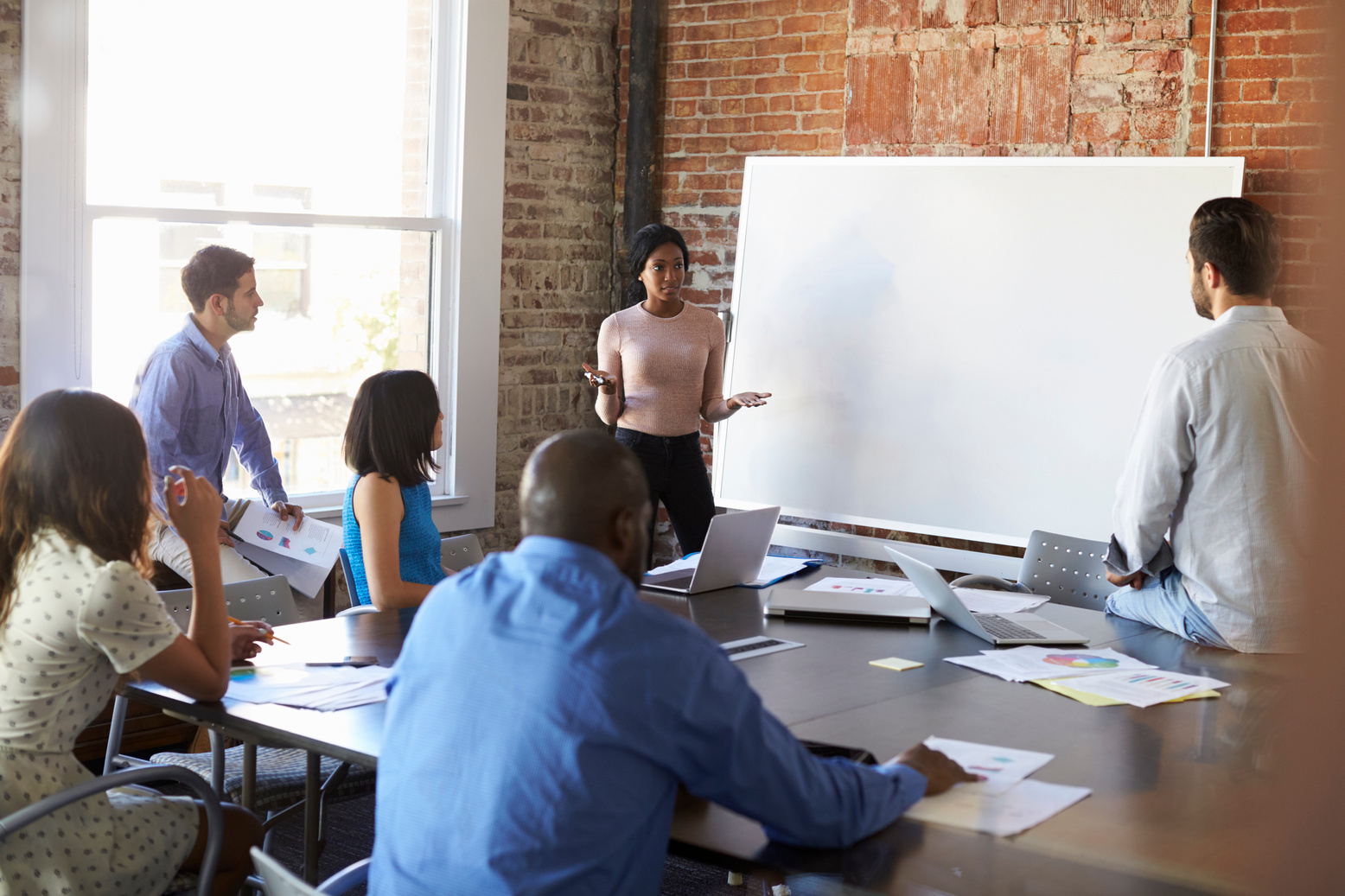 Woman Leading a Meeting in the Boardroom